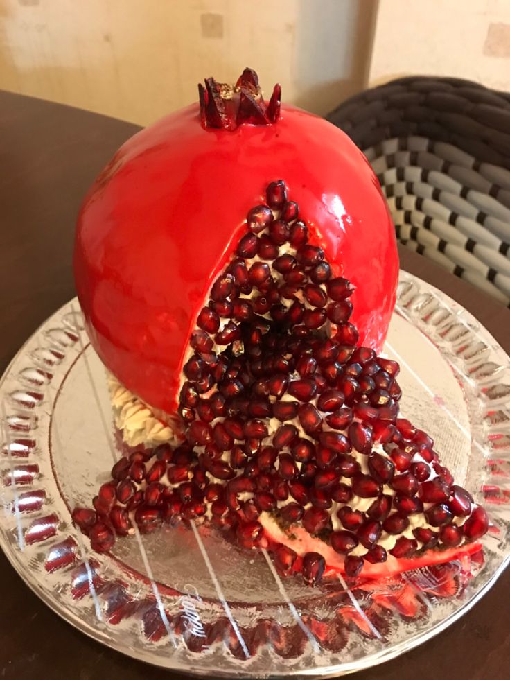 a pomegranate is cut into pieces and placed on top of a plate