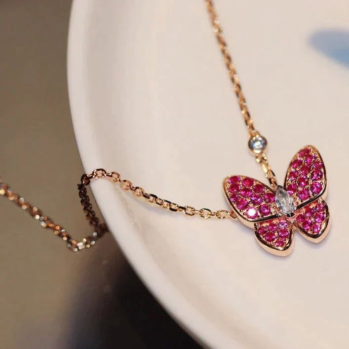 BUTTERFLY RED DIAMOND PINK GOLD NECKLACE Pink Butterfly Charm Pendant Jewelry, Pink Pendant Necklace With Butterfly Charm, Pink Butterfly Charm Pendant Necklace, Elegant Pink Butterfly Necklace For Gift, Elegant Pink Butterfly Necklace Gift, Luxury Pink Necklace For Party, Pink Butterfly Necklace For Party, Pink Butterfly Charm Necklace, Luxury Pink Necklace For Gift