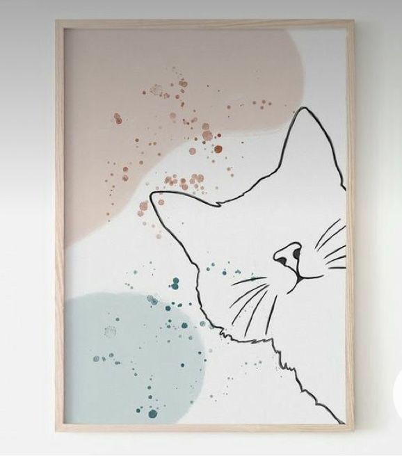 a painting with a cat's face on the wall next to a white wall