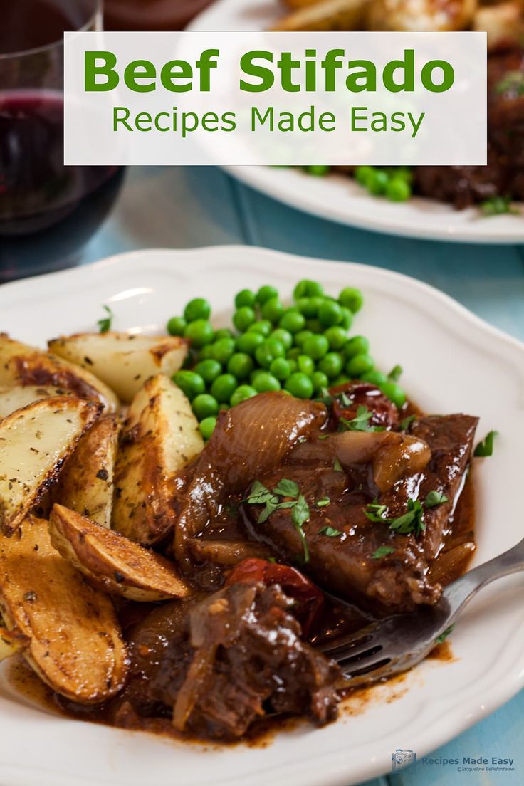 two plates of food with meat, potatoes and peas on the table next to wine glasses