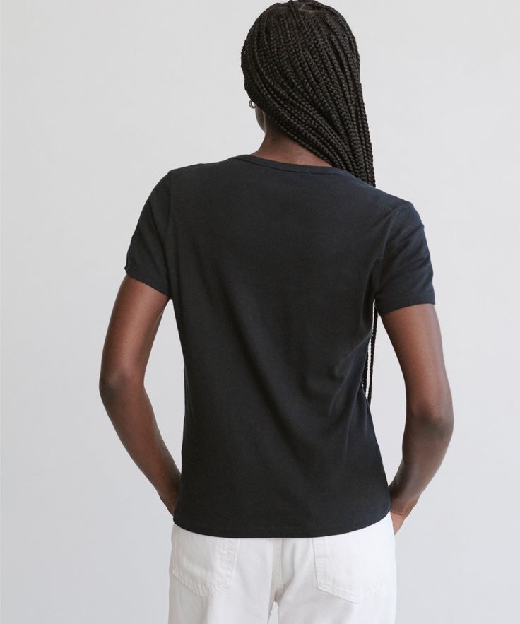 Cotton Slim Tee Black A fitted, feminine update to our Basic Tee, perfect for layering and anything in between. Super-soft, made-in-America cotton looks as good as it feels. 100% cotton. Made in Los Angeles. Classic Fitted Cotton T-shirt, Classic Fitted T-shirt For Casual Gatherings, Simple Cotton Tops For Casual Gatherings, Fitted Everyday T-shirt, Basic Cotton Tops For Casual Gatherings, Basic Shirttail Hem Tops, Simple Everyday Fitted Top, Simple Fitted Everyday Top, Fitted Cotton T-shirt For Work