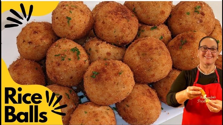 a man holding a plate full of fried food next to a pile of tater tots