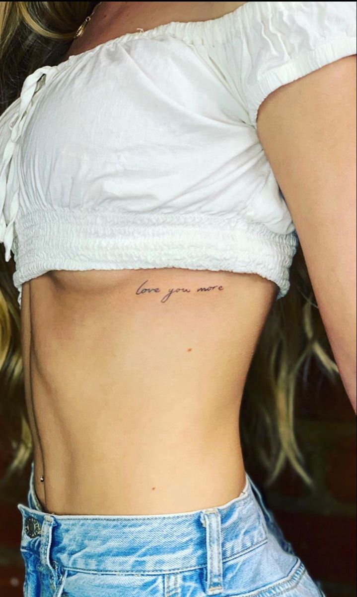 a woman with a small tattoo on her stomach that says, you can't stop