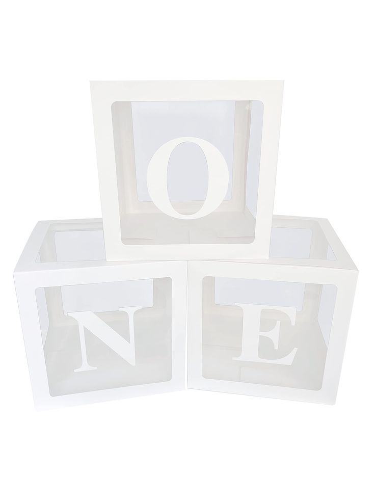 three white blocks with the letters o and e on them