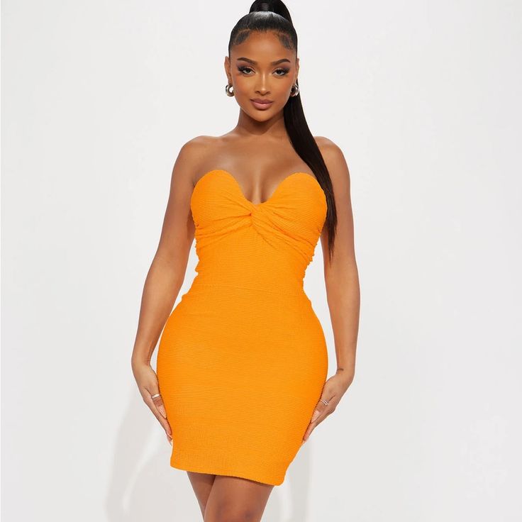 New With Tags Fitted Orange Sundress For Party, Spring Orange Mini Bodycon Dress, Orange Mini Dress For Date Night, Flirty Orange Bodycon Dress For Spring, Orange Strapless Dress For Date Night, Strapless Orange Dress For Date Night, Chic Fitted Orange Sundress, Orange Knee-length Mini Dress For Night Out, Orange Bodycon Midi Mini Dress