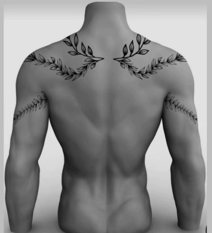 the back of a man's body with tattoos on his arms and chest,