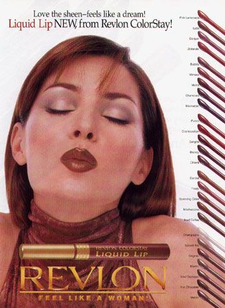 a woman with her eyes closed and makeup brushes in front of her face on the cover of revlon magazine