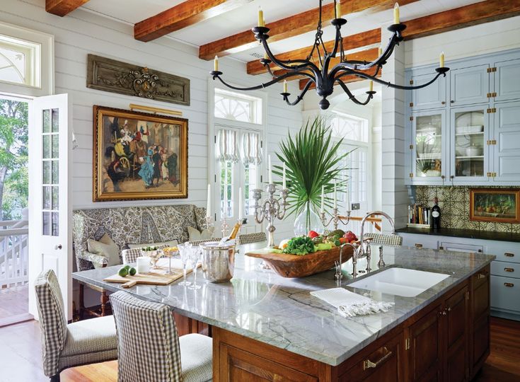 a large kitchen with an island in the middle