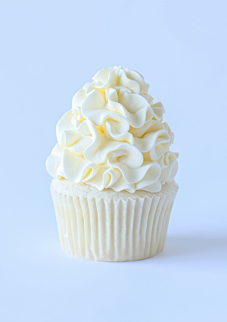 a cupcake with white frosting on top