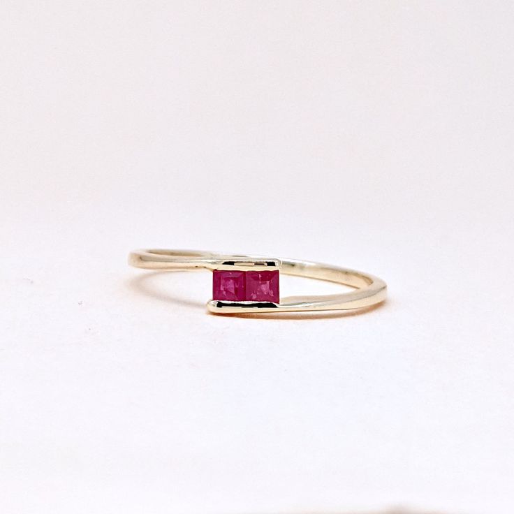 Natural Fine Ruby Ring. Baguette Stone Ring. Precious Gemstone Ring in 14k SOLID GOLD For Her from our Capsule Jewelry Collection. Ruby Baguette Gemstones are set in Chenal Setting in our Factory. Gold Ring AA+ Quality. Perfect Gift For Everyday or July Birthstone Gift for Your Loved Ones. ►  DIMENSIONS : ◆ Gemstone : Ruby 0.70 Cts (2 pcs)                       ◆ Stone size : 2.5*2.5 mm                                     ◆ Shank Width : 1 mm      ◆  Material :  14k Yellow Gold          Made to Order      EACH Ring is Stamped With 585 Marked As 14k GOLD International Standard. All my gemstones are hand-selected for best quality assurance, then precisely sawed, and shaped into the desired geometry. The precious stones are then delicately grinned, sanded, and hand-polished to make sure each Minimal Jewelry Design, Capsule Jewelry, Ruby Ring Designs, 14k Gold Ruby Ring, Gold Ruby Ring, July Birthstone Ring, Ring Jewellery Design, Ring Baguette, Ruby Ring Gold