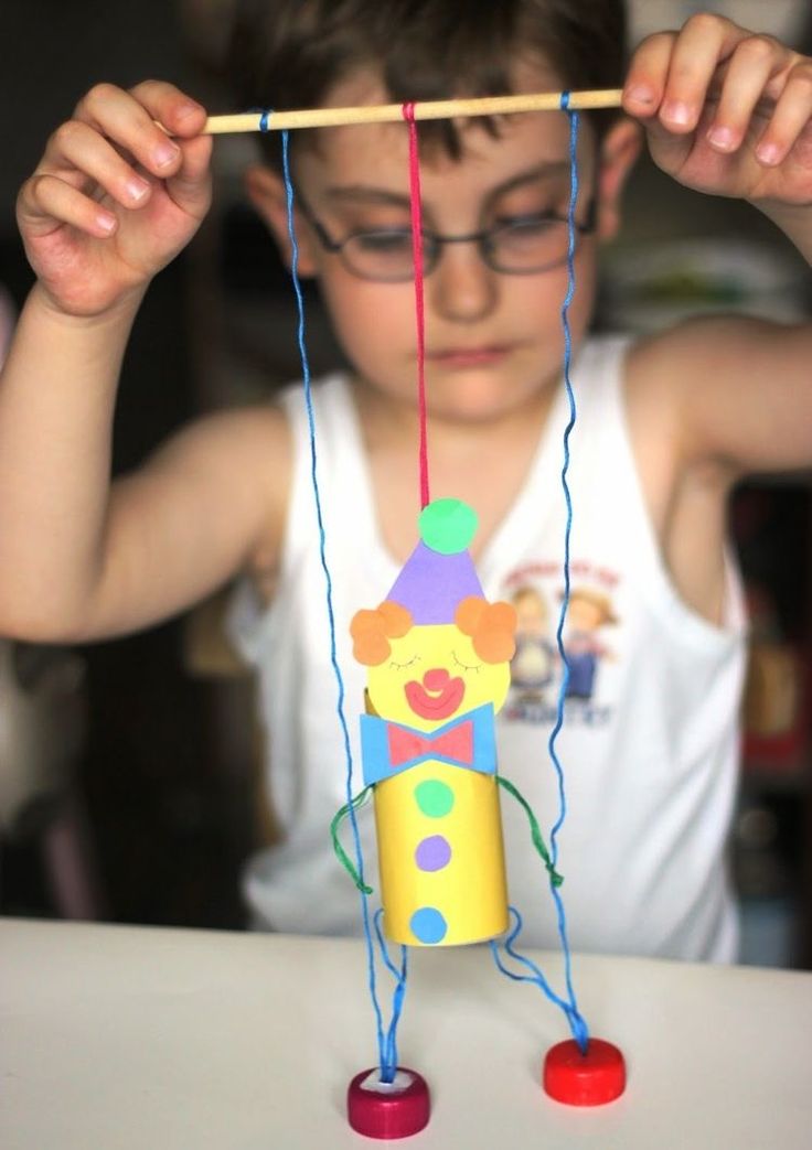 a young boy is playing with a toy