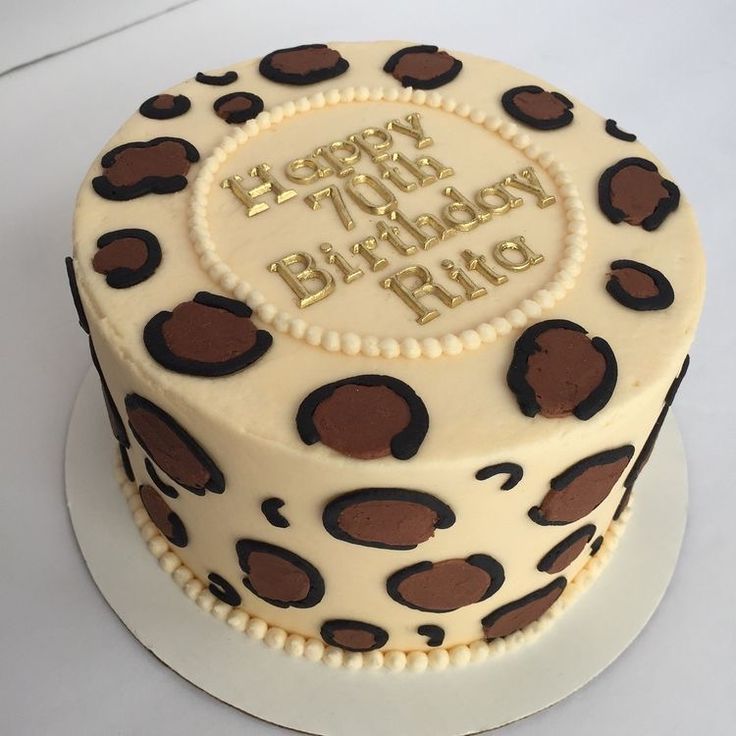 a birthday cake with leopard print on it