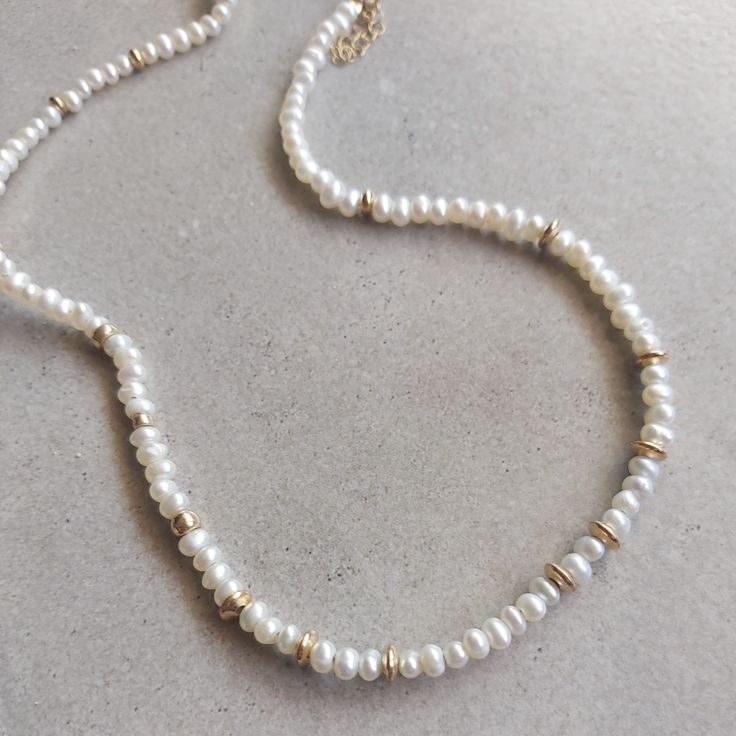 Dainty Freshwater Pearl Necklace, Pearl Chocker Necklace, Tiny Pearl Beaded, Pearl Bead Necklace, Small Pearl Necklace, Genuine Pearl GiftStunning necklace- delicate beadedcklace with pearls and gold filled beads.Beaufitul handmade pearls necklace , great for summer, wedding, mother's day gift .This necklace is perfect for yourself, giving as a special gift, or bridesmaid necklace**Length - 16" + exnsion**Beads size -4 mm.**Made from natural freshwater pearls and gold filed beads .If you would like this chain altered, please convo me.All my jewelry are packed in an elegant gift box.If you want to give it as a gift you can specify the address and I'll be happy to send it on your behalf. Small Pearl Necklace, Beaded Pearl Necklace, Handmade Pearl Necklace, Pearl Bead Necklace, Pearl Gifts, Chocker Necklace, Pearls Necklace, Freshwater Pearl Necklace, Necklace Pearl