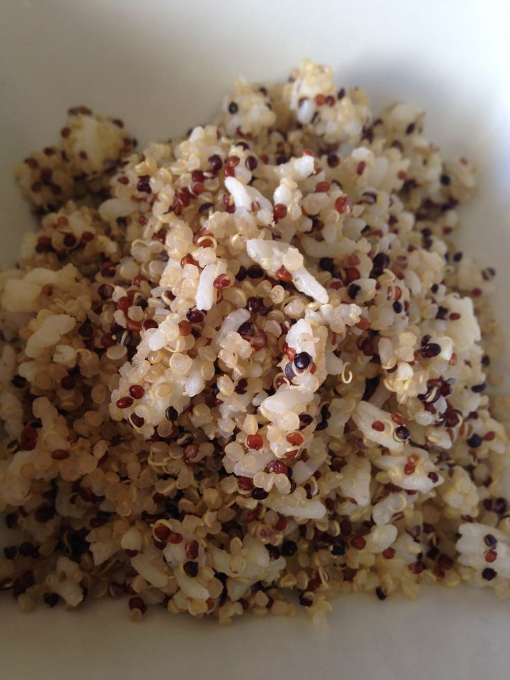 a white bowl filled with lots of food