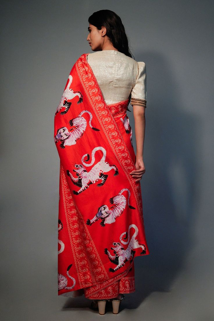 Red chanderi saree with all-over tiger and floral print. Comes with an unstitched plain golden lurex blouse fabric.
Components:2
Pattern: Printed
Type of Work: Floral, Tiger
Fabric: Saree: Chanderi; Blouse: Lurex
Color: Red
Other Details:
Note: The blouse worn by the model is not for sale
Occasion: Destination Wedding, Puja - Aza Fashions Red Floral Saree, Red Chanderi Saree, Blouse Yoke, Floral Saree, Clothing Website, Plain Blouse, Red Saree, Hand Woven Textiles, Clothing Websites