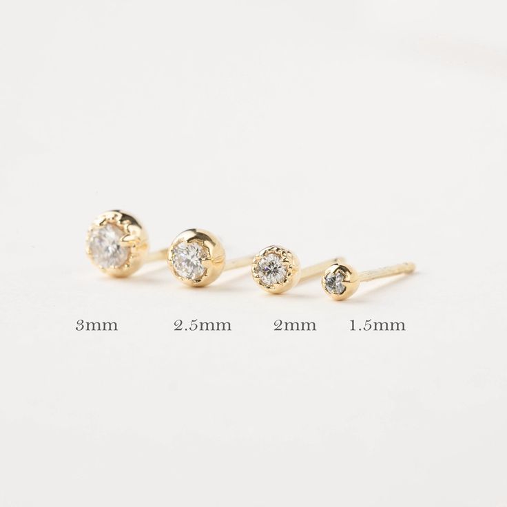 The perfect dainty 14k solid gold diamond studs to jazz up your everyday look. Every woman needs one pair of simple diamond studs to add to their collection. This classic earring makes a sophisticated accessory for women of all ages. Purchase this versatile studs for special occasions such as birthdays, anniversaries, Christmas, Mother's Day, Valentine's Day, or even for bridesmaids! * Sold as a single stud or a pair * 1.5mm diamond weighs 0.015ct, for a pair 0.03ctw. * 2mm diamond weighs 0.04ct Minimalist Diamond Piercings With Diamond Accents, Minimalist Diamond White Piercings, Minimalist Round Cut Diamond Piercings, Minimalist Diamond Piercings In Diamond White, Minimalist Diamond White Diamond Piercings, Minimalist Diamond Piercings With Single Diamond, Minimalist Diamond Piercing With Single Diamond, Classic 14k Gold Piercings With Single Diamond, 14k White Gold Piercings For Anniversary