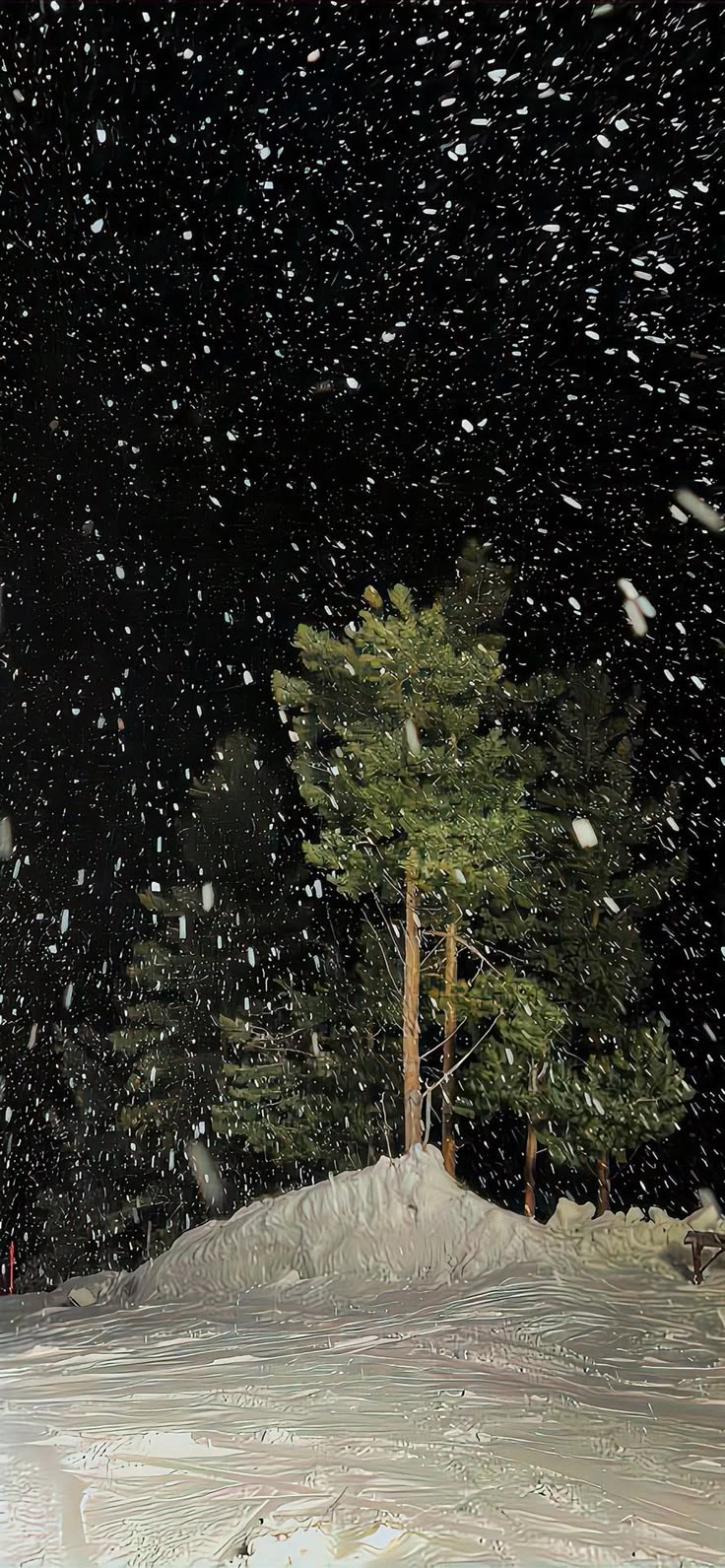 a man riding skis down the side of a snow covered slope under a sky full of stars