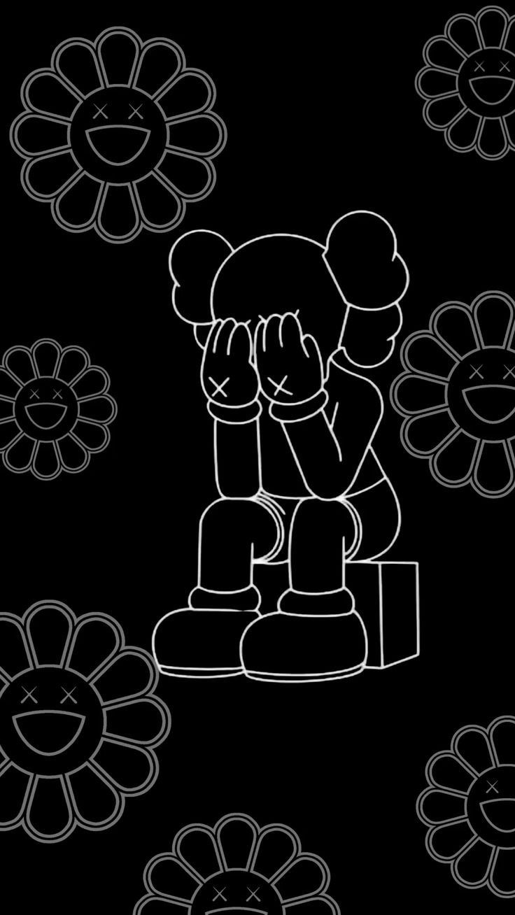 a black and white drawing of a person sitting in front of flowers