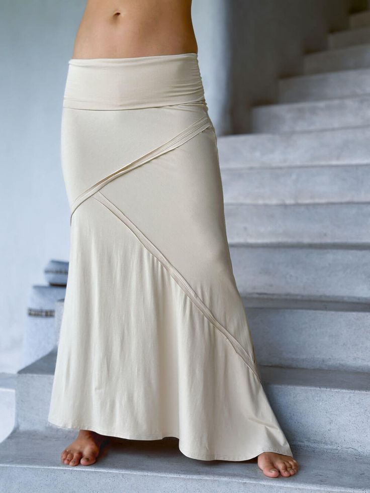 women's stretchy rayon jersey cream maxi skirt with raised stitch detail #color_cream Spring Fitted Maxi Skirt In Elastane, Chic Skirted Fitted Bottoms, Chic Fitted Skirted Bottoms, Fitted Elastane Maxi Skirt For Spring, Summer Flared Skirt In Elastane, Versatile Solid Color Flared Maxi Skirt, Casual Fitted Flared Maxi Skirt, Relaxed Lined Skirt With Flared Hem, Versatile Fitted Flared Skirt