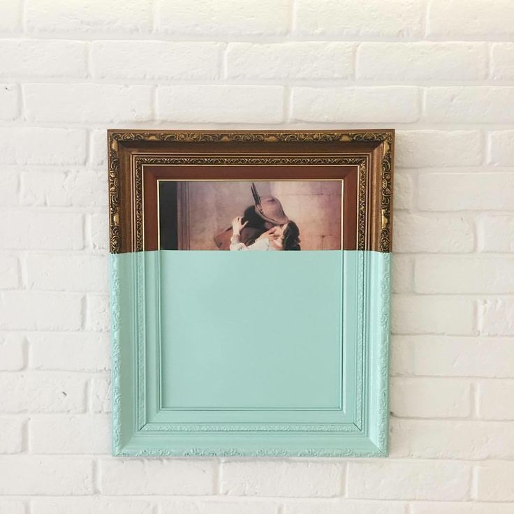 an old photo frame hanging on the wall