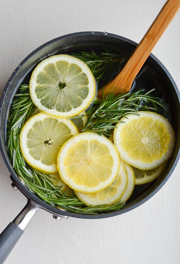 lemons and rosemary are being cooked in a skillet