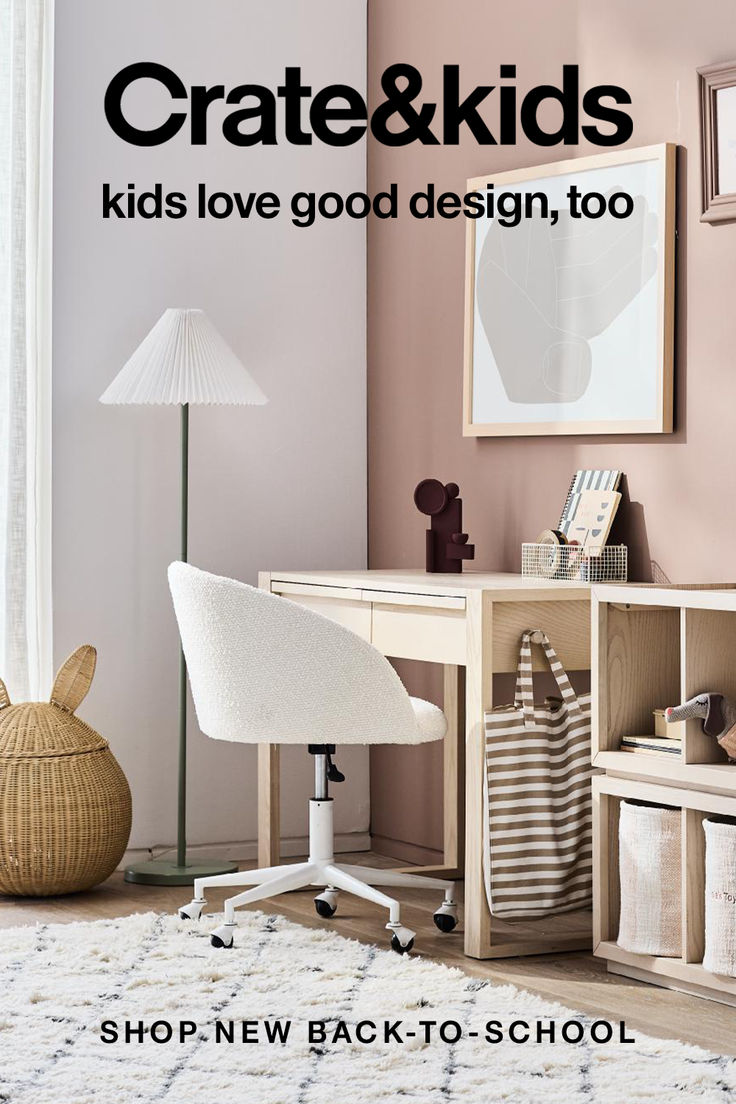 a white desk sitting next to a chair in a room on top of a rug