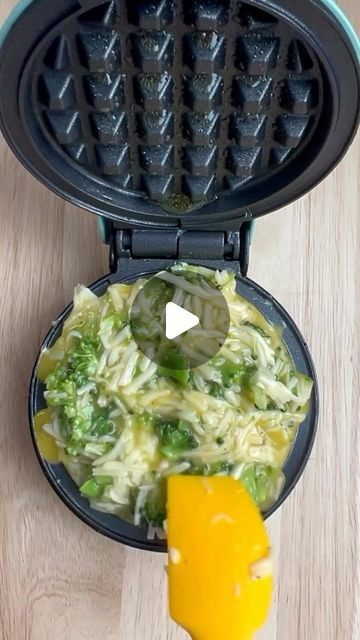 a waffle maker with broccoli and cheese in it