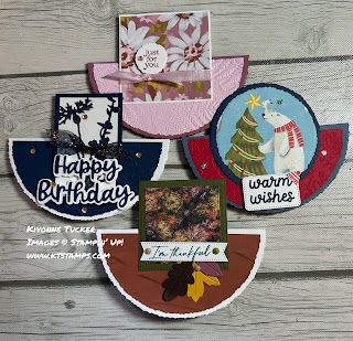 four different birthday cards on top of a wooden table with white wood planks in the background