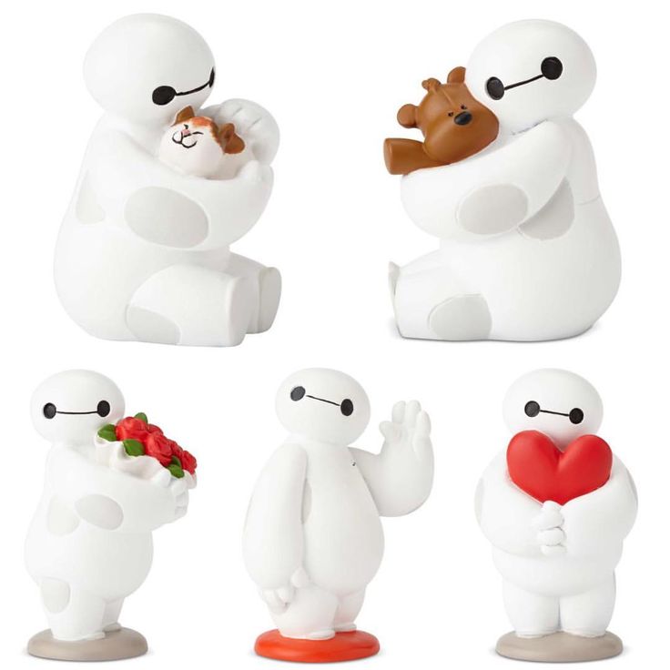 four different types of toys are shown in the shape of polar bears, one holding a heart