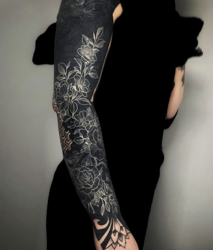 a woman with a tattoo on her arm