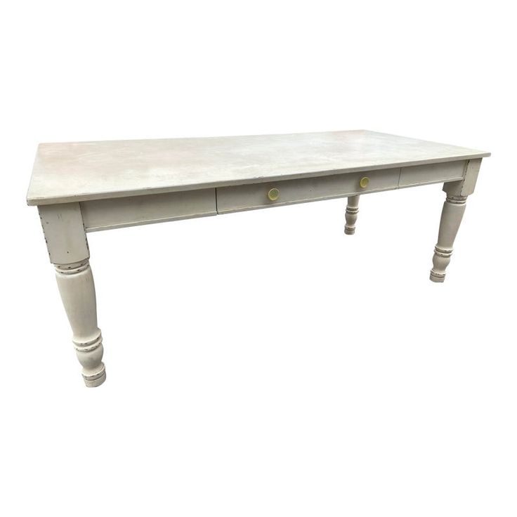 a white wooden table with two drawers on one side and an open drawer on the other