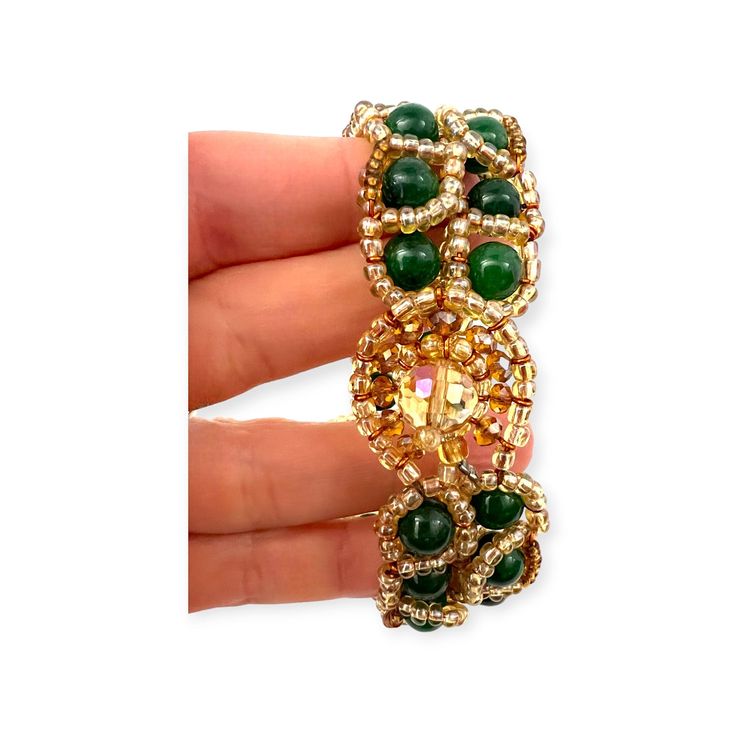 A special beaded bracelet with multi-colored beads of jadeite (green jade) and malachite in an art deco pattern. The green gemstone (malachite) has two rows of green jade (jadeite) towards the front of the bracelet for visual interest. The beads are all surrounded by golden colored seed beads which highlights the beautiful green tones of the gemstones to stunning effect. This special piece is from a husband and wife team that take gemstones such as jade and present them in beautiful novel ways. Horn Bracelet, Horn Earrings, Multicolor Jewelry, Tiger Eye Jewelry, Deco Pattern, Horn Jewelry, Carnelian Jewelry, Lapis Lazuli Jewelry, Yellow Jewelry