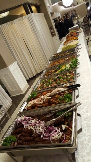 a buffet line with many different types of food