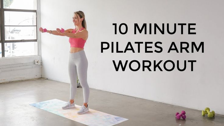 a woman standing on a yoga mat with the words 10 minute pilates arm workout