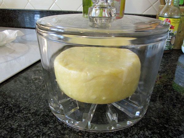 a glass container filled with food on top of a counter