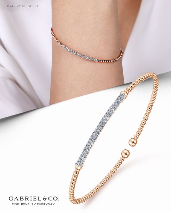 Two large beads sit at each end of this bracelet for a definitive cap to a beautiful piece of jewelry. Each bead is in 14K rose gold for a look that is equal parts classic and contemporary. The middle of the bracelet shows off a bar of dazzling diamonds that will catch the eye of anyone in the room.  BG4262-65K45JJ #GabrielNY #DiamondJewelry #FineJewelry #Gabriel&Co #UniqueJewelry #FineJewelry#FashionJewelry #GiftIdeas#UniqueGifts  #Bangle#Fashion Bangle #Diamond Bangle #YellowGold Bangle   #Ban Luxury Rose Gold Cuff Bracelet For Anniversary, Modern Luxury Rose Gold Cuff Bracelet, Luxury Pave Set Cuff Bracelet For Wedding, Bangle Diamond, Large Beads, Bangles Style, Diamond Bangle, Gold Fashion, Street Chic