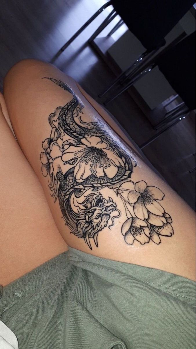 a woman with a tattoo on her thigh