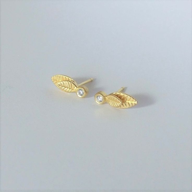 "These are elegant stud earrings, inspired by leaves. They are great to wear every day but look very fine and prestigious with sparkling diamonds*. They are made of 14k gold stamped 14k on the backside and have an elegant matte finish. You have to choose which color 14k gold you want the earring to be- yellow or white. I plate the white gold in rhodium plating, as is common in white gold jewelry.  The size of each earring Is 0.58 \\ 0.23 inches ( 1.5 \\ 0.6 cm ) These are \"made to order\" earri Elegant Leaf Shaped Earrings As Gift, Elegant Leaf-shaped Earrings For Gift, Nature-inspired Gold Earrings For Anniversary, Order Earrings, Woodland Earrings, Woodland Wedding, White Gold Jewelry, Sparkle Diamonds, Real Diamonds