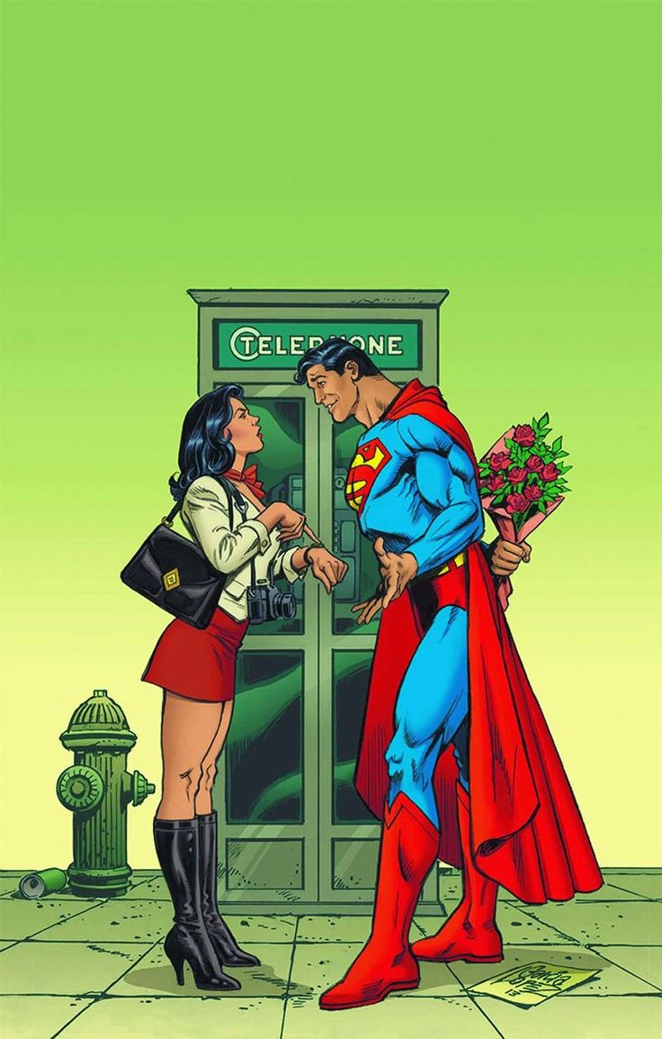 superman and wonder woman greeting each other in front of a phone booth