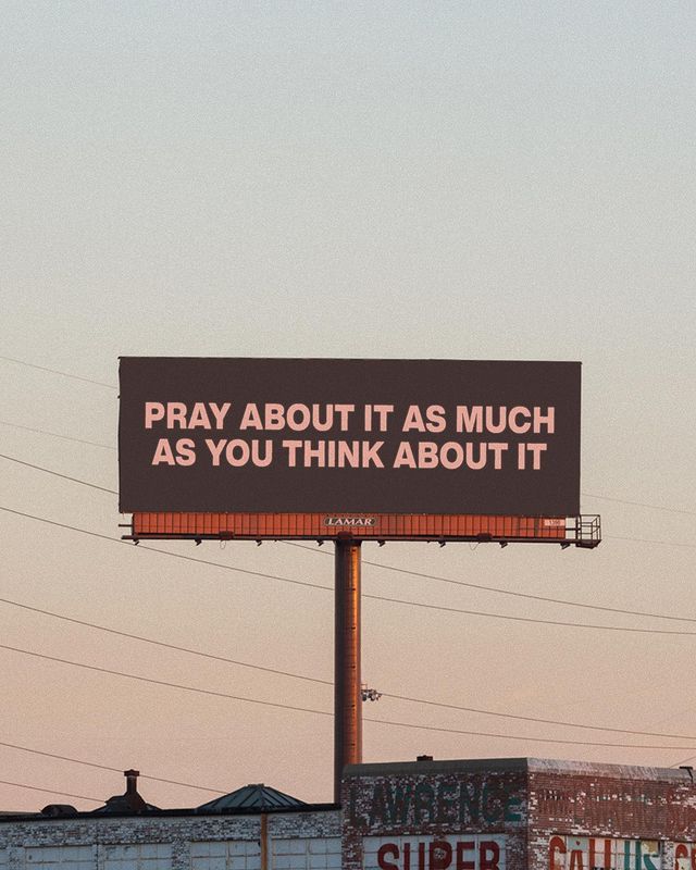 a billboard on the side of a building that says pray about it as much as you think about it