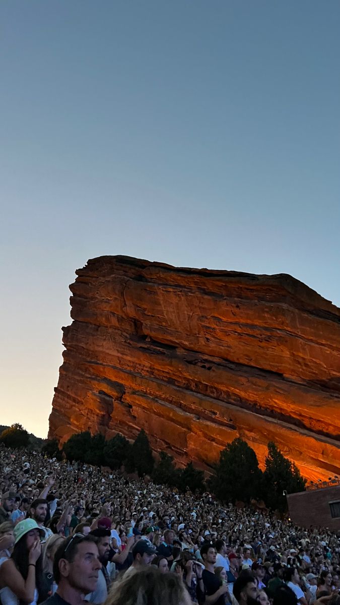 Red rocks, amphitheater, concert crowd Post Grad Life Aesthetic, Zach Bryan Red Rocks, Red Rocks Concert Outfit, Boulder Aesthetic, Red Rocks Aesthetic, Red Concert Aesthetic, Rock Concert Aesthetic, Red Rocks Amphitheater Aesthetic, Rock Concert Backstage Aesthetic