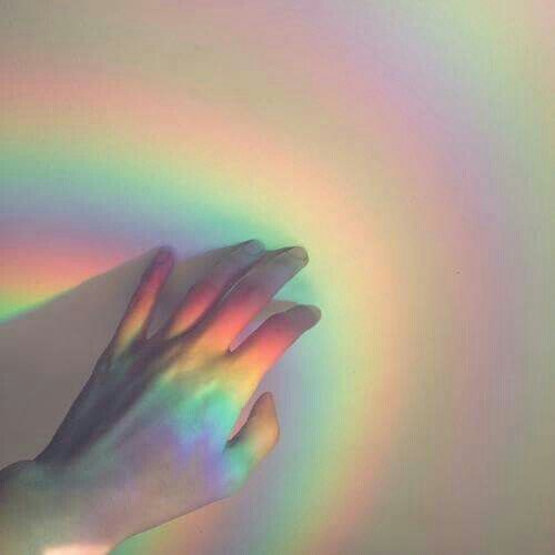 a woman's hand holding onto a rainbow colored object with the words what a shame if you were mine