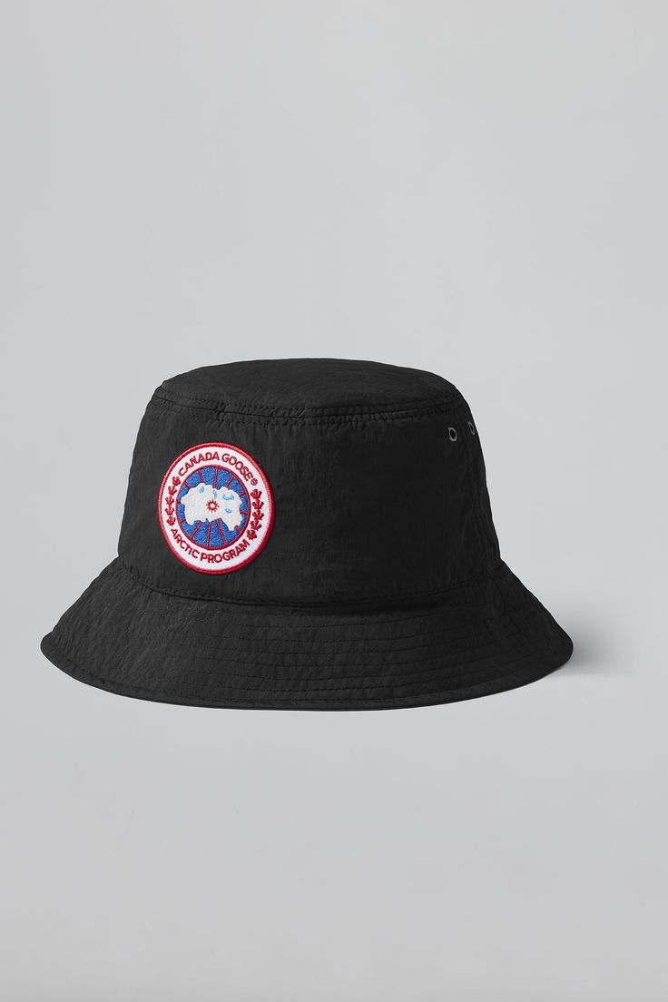 Designed  for  all-day  wear and sun protection, the Haven Bucket hat has you covered from all angles. Crafted from our Dura-Force Light for breathability and comfort. It features an adjustable cord lock for adaptability, reflective tape for low light visibility, and our signature Arctic Disc logo. Canada Goose Hat, Canada Goose Logo, Bucket Hat White, Bucket Hat Design, Les Angles, Mens Bucket Hats, Bucket Hat Black, Reflective Tape, North Star