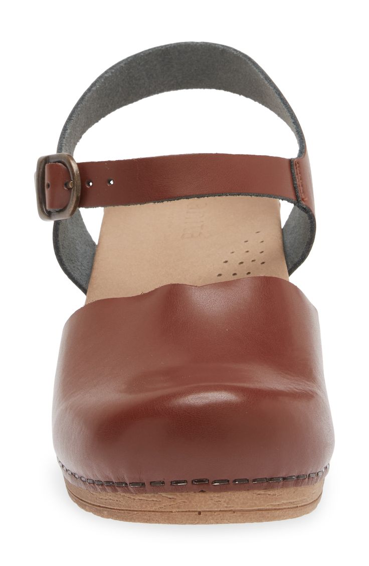 Perforations on the anatomically contoured footbed mean fresh stepping in this comfortable clog crafted with a rocker bottom for added support. Contoured footbed with arch support Synthetic, upper, lining and sole Made in Poland Comfortable Brown Clogs With Removable Insole, Everyday Brown Clogs With Leather Footbed, Brown Leather Footbed Clogs For Everyday, Brown Round Toe Clogs For Walking, Modern Slip-on Clogs With Arch Support, Comfortable Clogs With Removable Insole And Round Toe, Comfortable Round Toe Clogs With Arch Support, Round Toe Clogs With Arch Support, Comfortable Ortholite Insole Clogs With Round Toe