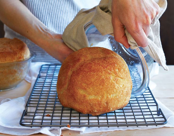 a person pouring batter on top of a loaf of bread