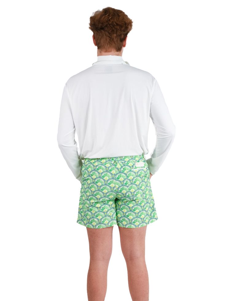 Navigate Style & Adventure with the Rhett Short Forget flimsy boardshorts and embrace versatile sophistication with the Rhett swim shorts. Designed for the man who seamlessly transitions from beachside lounging to boat deck chilling, these shorts offer superior style and functionality wherever your summer takes you. Land & Sea Ready: Quick-drying fabric: Dive into the ocean, then hit the town without a worry. The shorts dry rapidly, keeping you cool and comfortable all day long. Built-in liner: Stretch Shorts For Beach Party, Short Swim Trunks For Spring Beach Party, Spring Beach Party Swim Trunks, Fitted Beachwear Shorts For Vacation, Green Stretch Surfing Shorts, Fitted Surfing Shorts For Summer, Fitted Shorts For Surfing In Summer, Casual Fitted Swim Trunks For Beach Party, Green Beachwear Bottoms With Upf 50+