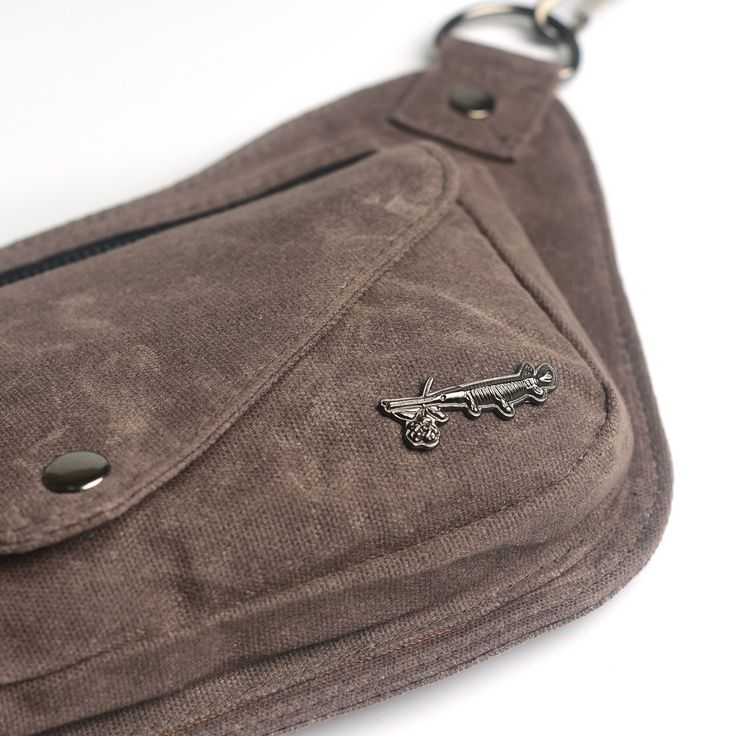 An earthy muted brown. The Lux Hip Pouch conforms to your body, keeps a slim profile and a sleek comfortable fit. Premium materials to keep things looking sharp while toting your essentials any time you want your hands free for doin' stuff. Rock it at the park, farmer’s market, music festivals, walks around the neighborhood, roller skating or a night out. -Available in 3 size options. Size 1 (XS-Medium) 28"-37”; Size 2 (Medium-XL) 33"-47"; Size 3 (XL-3XL) 42-64" -3 zippered compartments. 1 on th Functional Brown Cotton Bags, Casual Brown Belt Bag For Everyday Use, Brown Belt Bag With Cell Phone Pocket For Outdoor, Brown Anti-theft Pouch Bag, Outdoor Brown Belt Bag With Zipper Pocket, Brown Pouch Belt Bag With Pockets, Brown Pouch With Zipper Pocket For Daily Use, Brown Pouch With Cell Phone Pocket For Everyday Use, Versatile Brown Pouch For Daily Use