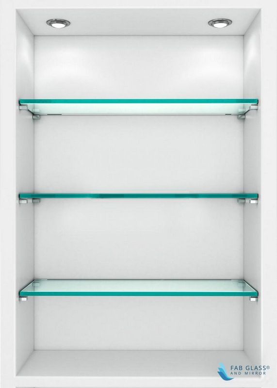 an empty white shelf with glass shelves on each side and two lights above the shelves