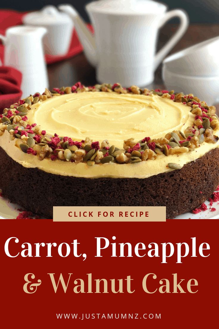 carrot, pineapple and walnut cake on a plate with coffee cups in the background