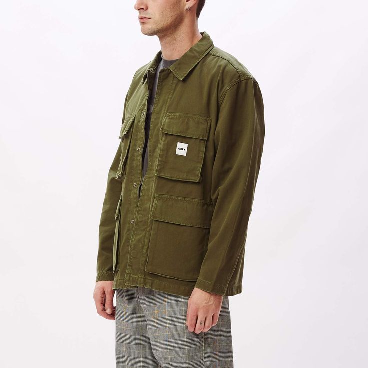 The Peace BDU (Battle Dress Uniform) jacket is constructed of 100% organic cotton and features a vintage look, full-zip closure with snap placket closure, four button closure pockets at front and a woven logo label sewn at chest. 100% organic cotton. Machine wash cold. Imported. By OBEY.Style: 121800440 Long-sleeved Cotton Utility Jacket For Outdoor, Winter Cotton Shacket With Multiple Pockets, Cotton Shacket With Pockets For Outdoor, Outdoor Cotton Shacket With Patch Pockets, Outdoor Cotton Shacket With Pockets, Military Utility Jacket With Patch Pockets, Everyday Utility Shacket With Multiple Pockets, Khaki Utility Shacket With Multiple Pockets, Khaki Utility Jacket With Patch Pockets